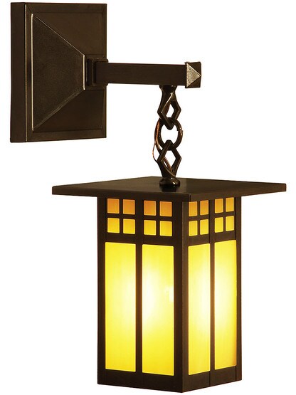Glasgow Single Sconce In Bronze Finish with Tan Glass.
